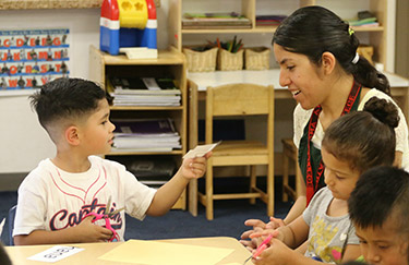 Instructor playing with child