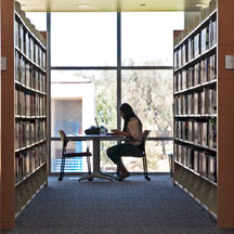 student in library