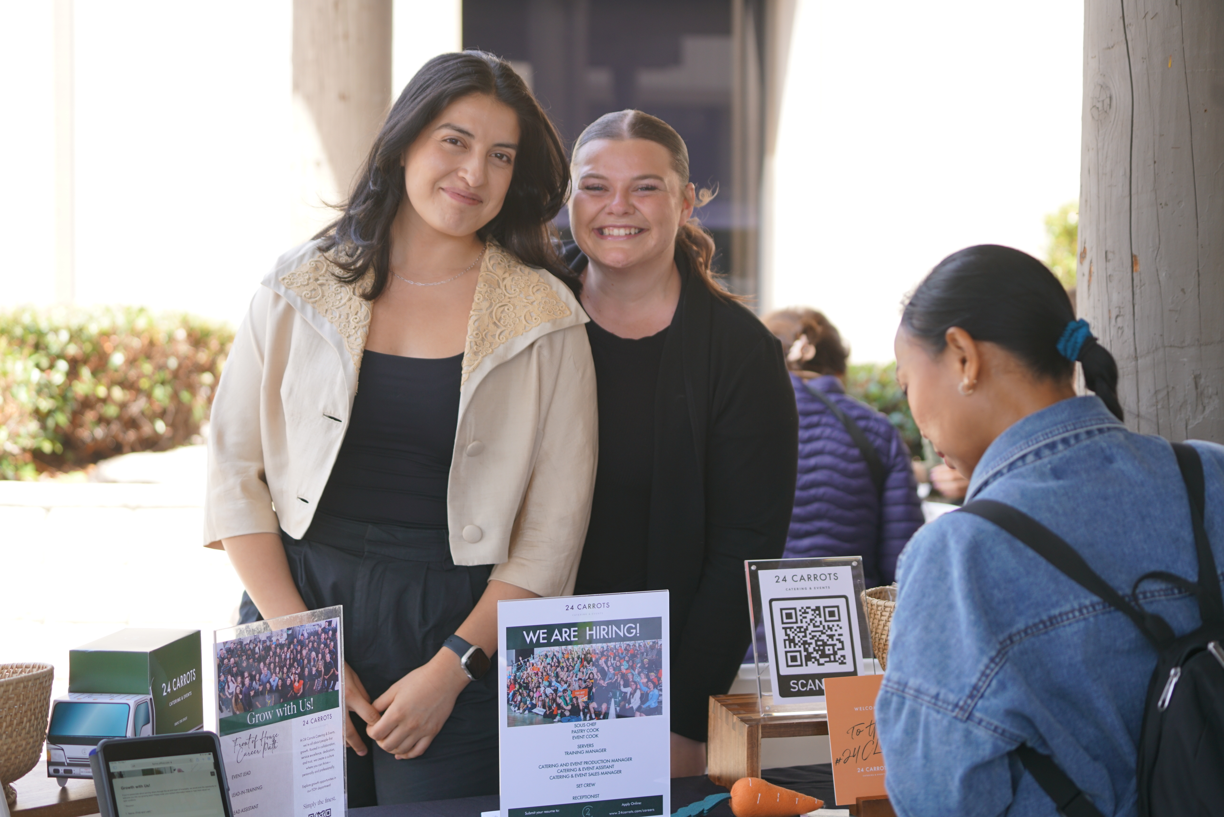 recruitment group smiling at their booth